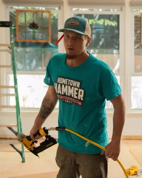 Team member with a trim nailer